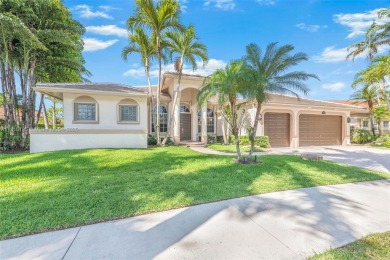 Luxury living awaits in this stunning one-story pool home on the on Weston Hills Country Club in Florida - for sale on GolfHomes.com, golf home, golf lot