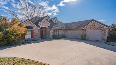 This three bedroom, two bathroom, large three car garage is on Granbury Country Club in Texas - for sale on GolfHomes.com, golf home, golf lot