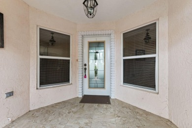 Luxuriously upgraded 3-bed, 2-bath lakefront home with over 1 on Spanish Lakes Fairways in Florida - for sale on GolfHomes.com, golf home, golf lot