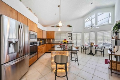 CUSTOM DESIGNED BY DON TRAURIG . . . FAIRWAY VIEWS OF 5TH HOLE on University Park Country Club in Florida - for sale on GolfHomes.com, golf home, golf lot