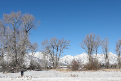 Enjoy beautiful Grand Teton views from this premier .84 acre lot on Jackson Hole Golf and Tennis Club in Wyoming - for sale on GolfHomes.com, golf home, golf lot