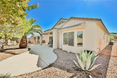 This popular Palm Desert model is move-in ready and filled with on Desert Willow Golf Course in Nevada - for sale on GolfHomes.com, golf home, golf lot