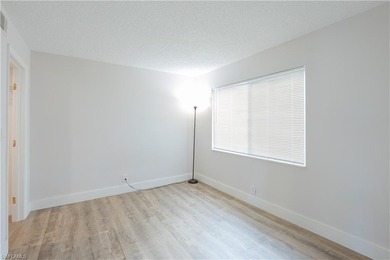 Cozy and modern 2-bedroom, 2-bathroom apartment with a carport on The Glades Golf and Country Club in Florida - for sale on GolfHomes.com, golf home, golf lot