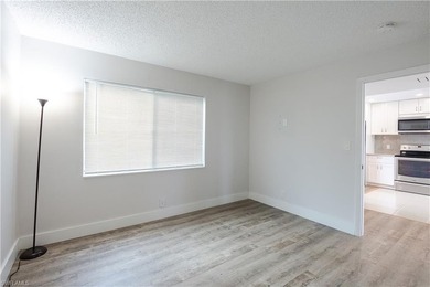 Cozy and modern 2-bedroom, 2-bathroom apartment with a carport on The Glades Golf and Country Club in Florida - for sale on GolfHomes.com, golf home, golf lot