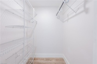 Cozy and modern 2-bedroom, 2-bathroom apartment with a carport on The Glades Golf and Country Club in Florida - for sale on GolfHomes.com, golf home, golf lot