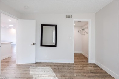 Cozy and modern 2-bedroom, 2-bathroom apartment with a carport on The Glades Golf and Country Club in Florida - for sale on GolfHomes.com, golf home, golf lot