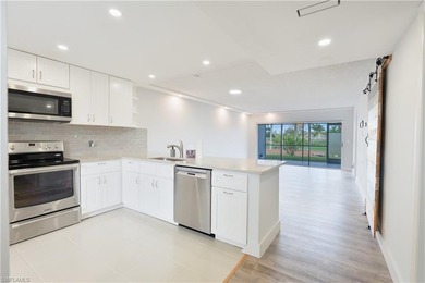 Cozy and modern 2-bedroom, 2-bathroom apartment with a carport on The Glades Golf and Country Club in Florida - for sale on GolfHomes.com, golf home, golf lot