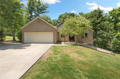 Tucked away in the cul-de-sac and spanning 2 lots, this stunning on Bella Vista - Metfield Golf Complex and Country Club in Arkansas - for sale on GolfHomes.com, golf home, golf lot