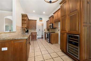 Tucked away in the cul-de-sac and spanning 2 lots, this stunning on Bella Vista - Metfield Golf Complex and Country Club in Arkansas - for sale on GolfHomes.com, golf home, golf lot