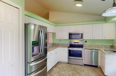 Featuring a rare 3 CAR GARAGE, this newer construction 3-bedroom on Oyster Creek Golf Club in Florida - for sale on GolfHomes.com, golf home, golf lot