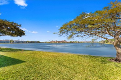 Experience vibrant 55+ living in this charming second floor on Flamingo Lakes Country Club in Florida - for sale on GolfHomes.com, golf home, golf lot