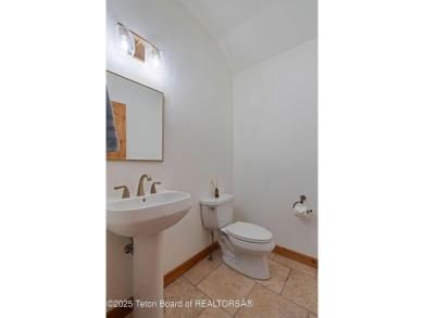 This well-designed Lupine model features an open-concept kitchen on Teton Springs Resort and Club in Idaho - for sale on GolfHomes.com, golf home, golf lot