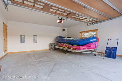 This well-designed Lupine model features an open-concept kitchen on Teton Springs Resort and Club in Idaho - for sale on GolfHomes.com, golf home, golf lot