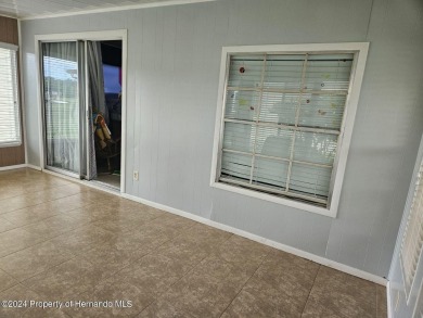 HOT TUB on large rear patio on the GOLF COURSE Located on a on High Point Golf Club, Inc. in Florida - for sale on GolfHomes.com, golf home, golf lot