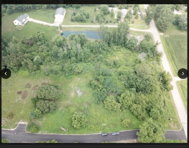 Build your dream home on this partially-cleared wooded lot in on Ravines Golf Club in Michigan - for sale on GolfHomes.com, golf home, golf lot
