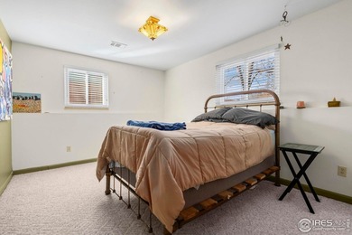 Located on a quiet street in the heart of Loveland, this home on The Olde Course At Loveland in Colorado - for sale on GolfHomes.com, golf home, golf lot