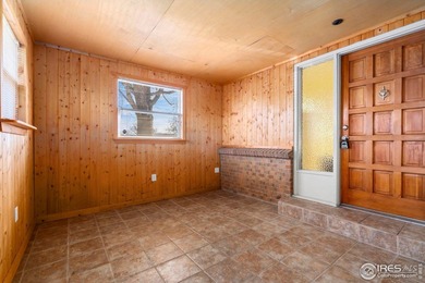 Located on a quiet street in the heart of Loveland, this home on The Olde Course At Loveland in Colorado - for sale on GolfHomes.com, golf home, golf lot