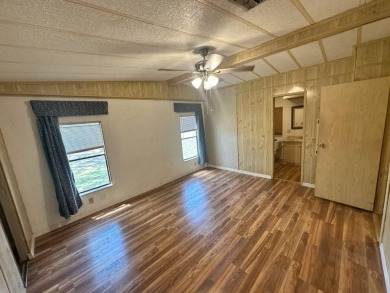 Lot Rent $1037.00    This well cared for 2-bedroom, 2-bathroom on Del Tura Golf and Country Club in Florida - for sale on GolfHomes.com, golf home, golf lot