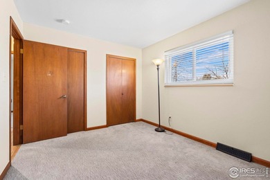 Located on a quiet street in the heart of Loveland, this home on The Olde Course At Loveland in Colorado - for sale on GolfHomes.com, golf home, golf lot