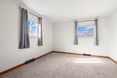 Located on a quiet street in the heart of Loveland, this home on The Olde Course At Loveland in Colorado - for sale on GolfHomes.com, golf home, golf lot