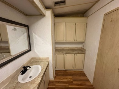 Lot Rent $1037.00    This well cared for 2-bedroom, 2-bathroom on Del Tura Golf and Country Club in Florida - for sale on GolfHomes.com, golf home, golf lot