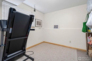 Located on a quiet street in the heart of Loveland, this home on The Olde Course At Loveland in Colorado - for sale on GolfHomes.com, golf home, golf lot