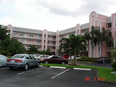 This condo is located in the prestigious *The Island* section of on Sunrise Lakes Phase IV Golf Course in Florida - for sale on GolfHomes.com, golf home, golf lot