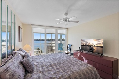 Straight from the pages of Coastal Living, this pristine on Isla Del Sol Yacht and Country Club in Florida - for sale on GolfHomes.com, golf home, golf lot