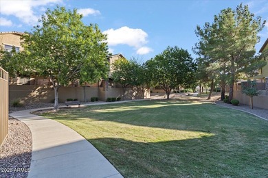 Move-in ready and beautifully updated! This end-unit townhome in on Augusta Ranch Golf Club in Arizona - for sale on GolfHomes.com, golf home, golf lot