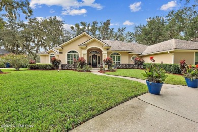 Overlooking the 11th hole, this Earl Whitehurst-built home on Hidden Hills Country Club in Florida - for sale on GolfHomes.com, golf home, golf lot