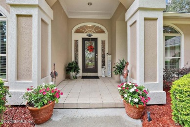 Overlooking the 11th hole, this Earl Whitehurst-built home on Hidden Hills Country Club in Florida - for sale on GolfHomes.com, golf home, golf lot