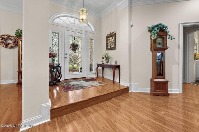 Overlooking the 11th hole, this Earl Whitehurst-built home on Hidden Hills Country Club in Florida - for sale on GolfHomes.com, golf home, golf lot