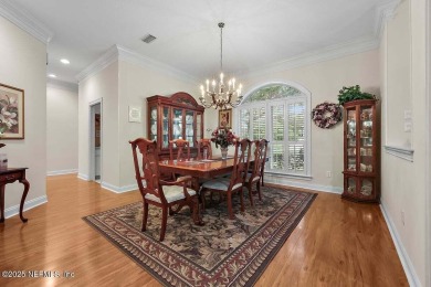Overlooking the 11th hole, this Earl Whitehurst-built home on Hidden Hills Country Club in Florida - for sale on GolfHomes.com, golf home, golf lot
