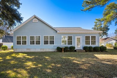 What a lovely home this one is, and it's just minutes from the on Pawleys Plantation Golf and Country Club in South Carolina - for sale on GolfHomes.com, golf home, golf lot