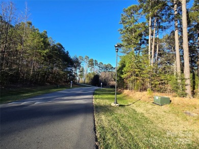 This Badin Lake area lot is located in the prestigious gated on Old North State Club at Uwharrie Point Golf community in North Carolina - for sale on GolfHomes.com, golf home, golf lot