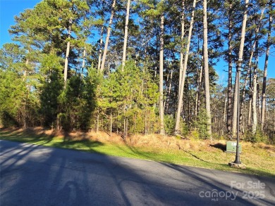 This Badin Lake area lot is located in the prestigious gated on Old North State Club at Uwharrie Point Golf community in North Carolina - for sale on GolfHomes.com, golf home, golf lot