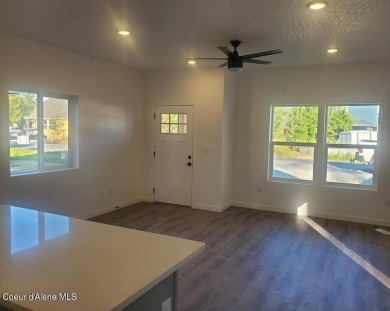 Charming 2-bedroom, 2-bath cottage nestled in a peaceful on Sandpoint Elks Golf Course in Idaho - for sale on GolfHomes.com, golf home, golf lot