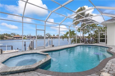 Welcome to your GULF ACCESS DREAM HOME! A commanding 4-bedroom on Palmetto-Pine Country Club in Florida - for sale on GolfHomes.com, golf home, golf lot