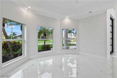 Welcome to your GULF ACCESS DREAM HOME! A commanding 4-bedroom on Palmetto-Pine Country Club in Florida - for sale on GolfHomes.com, golf home, golf lot