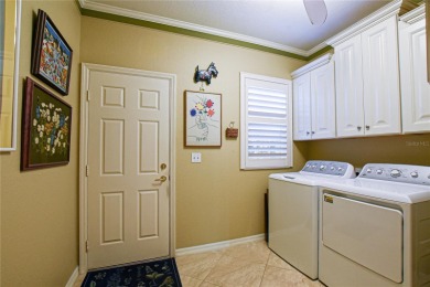 Discover your dream home in this exquisite 1936 sq. ft. Sanibel on Eagle Ridge At Spruce Creek Country Club in Florida - for sale on GolfHomes.com, golf home, golf lot