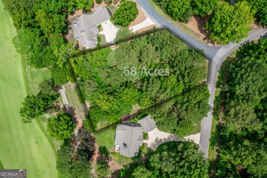 Located on the 6th hole inside the gates of the Reynolds/Great for sale on GolfHomes.com