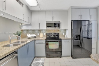 Beautifully updated & artist-decorated 2-bed, 2-bath condo with on Pine Island Ridge Country Club in Florida - for sale on GolfHomes.com, golf home, golf lot