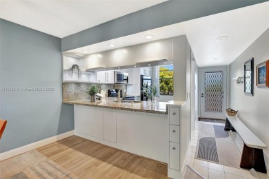 Beautifully updated & artist-decorated 2-bed, 2-bath condo with on Pine Island Ridge Country Club in Florida - for sale on GolfHomes.com, golf home, golf lot
