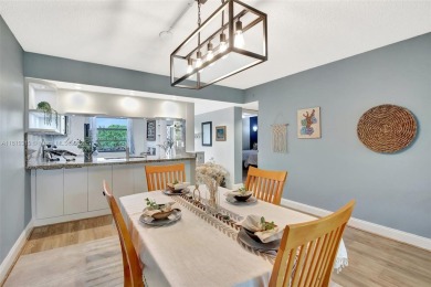 Beautifully updated & artist-decorated 2-bed, 2-bath condo with on Pine Island Ridge Country Club in Florida - for sale on GolfHomes.com, golf home, golf lot