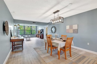 Beautifully updated & artist-decorated 2-bed, 2-bath condo with on Pine Island Ridge Country Club in Florida - for sale on GolfHomes.com, golf home, golf lot
