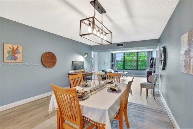Beautifully updated & artist-decorated 2-bed, 2-bath condo with on Pine Island Ridge Country Club in Florida - for sale on GolfHomes.com, golf home, golf lot