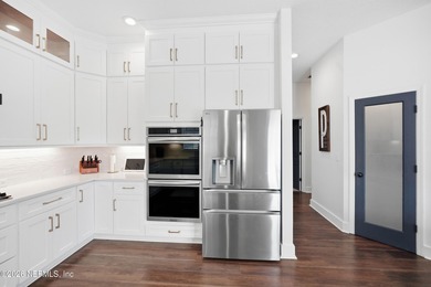 Imagine ending your day on the covered lanai, grilling in the on St. Johns Golf and Country Club in Florida - for sale on GolfHomes.com, golf home, golf lot