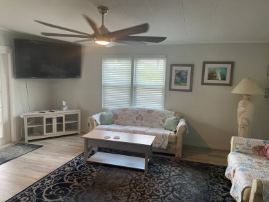TIRED OF SNOW,ICE AND COLD, TRADE IT IN FOR SUN,WARM AND WHITE on Lake Fairways Country Club in Florida - for sale on GolfHomes.com, golf home, golf lot