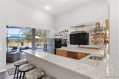 Experience elevated Florida living in this beautifully designed on Southern Woods Golf Club in Florida - for sale on GolfHomes.com, golf home, golf lot