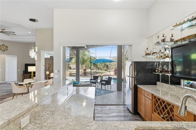 Experience elevated Florida living in this beautifully designed on Southern Woods Golf Club in Florida - for sale on GolfHomes.com, golf home, golf lot